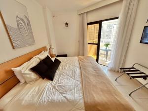 Ένα ή περισσότερα κρεβάτια σε δωμάτιο στο SHB - Apê Retrô Aconchegante Beira-Mar +33 φωτογραφίες