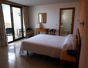 Ένα ή περισσότερα κρεβάτια σε δωμάτιο στο Vintage Hotel Mercedes +26 φωτογραφίες