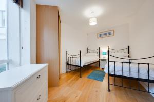 En eller flere senge i et værelse på Turnstones