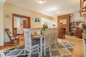 a dining room with a table and chairs at Fieldview in East Barsham