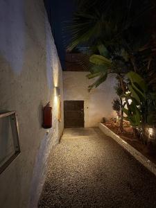 a hallway with a light on the side of a building at ASARAG GUEST HOUSE & Lodge in Mirleft