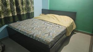 Ένα ή περισσότερα κρεβάτια σε δωμάτιο στο JINS Homestay