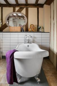 a bathroom with a white sink and a mirror at Church Farm in Halesworth +15 photos