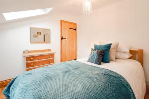 Ένα ή περισσότερα κρεβάτια σε δωμάτιο στο Lime Quay Cottage