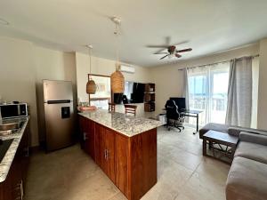 a kitchen with a refrigerator and a counter top at Apartment OceanView near Bacalar in Mahahual