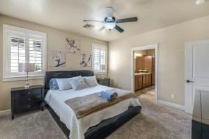 a bedroom with a bed and a ceiling fan at Havasu Duke Pool Spa Basketball Central in Lake Havasu City +40 photos
