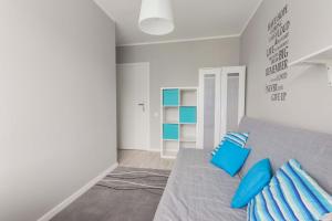 Posteľ alebo postele v izbe v ubytovaní Apartamenty Startowa Gdańsk