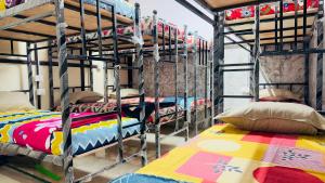 a room with four bunk beds in a room at StayIn-SGH in Mysore