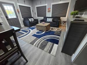 a living room with couches and a coffee table at The Casita in Nampa