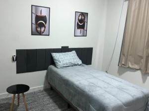 Ένα ή περισσότερα κρεβάτια σε δωμάτιο στο Ideal Suite em Brusque