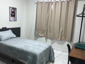 Ένα ή περισσότερα κρεβάτια σε δωμάτιο στο Ideal Suite em Brusque