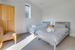 Ένα ή περισσότερα κρεβάτια σε δωμάτιο στο Daisy Lodge