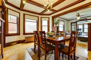 a dining room with a wooden table and chairs at Great for Travel Nurses, Remote Workers! MPLS Home in Minneapolis