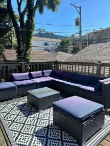 a patio with a blue couch and a table at NEW! Spacious Art Deco Modern 5 BD/3BA Condo in Chicago