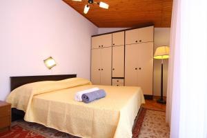 Posteľ alebo postele v izbe v ubytovaní Villa Perla