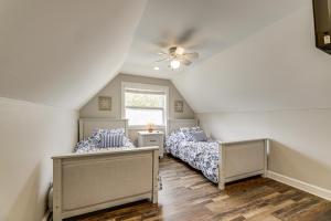 a bedroom with two beds and a ceiling fan at Modern Comfort Near Columbus Home with Yard and Porch in London