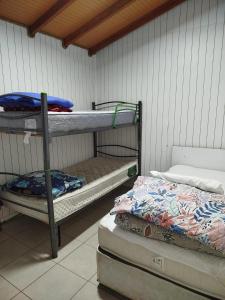 Ένα ή περισσότερα κρεβάτια σε δωμάτιο στο Cabañas Mañio Melipeuco