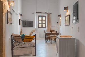 a living room with a couch and a table at Katharsis Palace 15th Century Art Hotel at Naxos Old Town IV in Naxos Chora