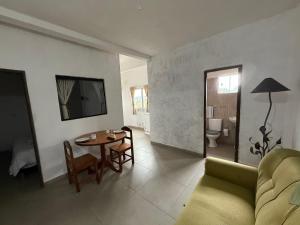 a living room with a couch and a table at Departamentos Imperial in Encarnación