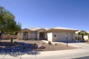 a house with a landscaping in front of it at Sun City Vistoso #1820 in Oro Valley