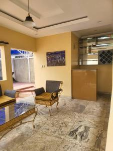 a living room with a couch and a table at The Perfect Place in Gwarinpa