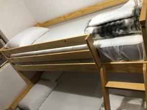 a couple of bunk beds in a room at Apartamento funcional cerca a Parque de Bello Antioquia in Bello +3 photos