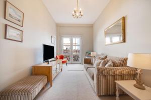 Televiisor ja/või meelelahutuskeskus majutusasutuses Curlew Cottage