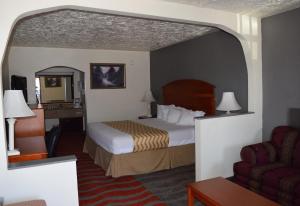 Postel nebo postele na pokoji v ubytování Travelodge Inn & Suites by Wyndham Norman