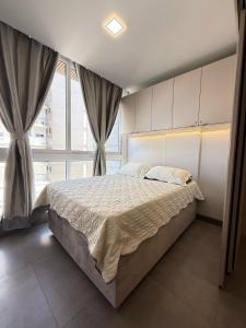 Postel nebo postele na pokoji v ubytování Livin Resort Home 317