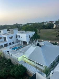 an aerial view of a house with a swimming pool at res Montesino in San Felipe de Puerto Plata