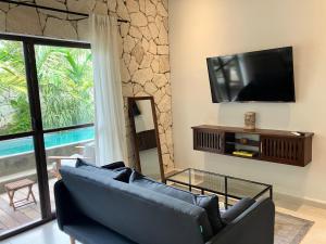 Et tv og/eller underholdning på Casa Xunan - Beautiful 1 Bedroom Apartment with pool