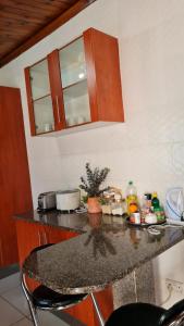 a kitchen with a granite counter top in a room at Villa Antonio Private Apartments in Lusaka