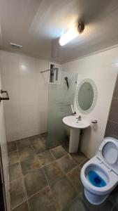 a bathroom with a toilet and a sink at 스테이 마산 in Changwon
