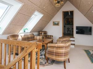 a living room with chairs and a table at 4 star holiday home in Hornsyld in Hornsyld