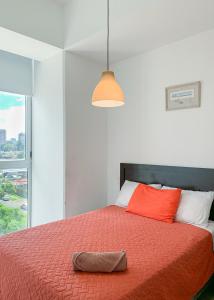 Ένα ή περισσότερα κρεβάτια σε δωμάτιο στο Narama 2 - Apartamento grande y familiar cerca del aeropuerto - Zona 13 de la Ciudad de Guatemala