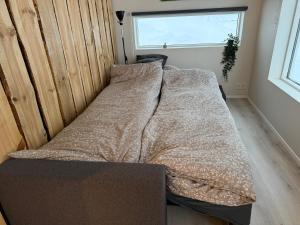 Ένα ή περισσότερα κρεβάτια σε δωμάτιο στο Kirkjufell View Cottages