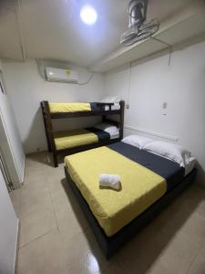 a bedroom with two bunk beds in a room at Casa Crespo Caribe Cartagena in Cartagena de Indias +6 photos