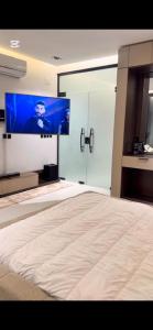 TV a/nebo společenská místnost v ubytování استديو رامس