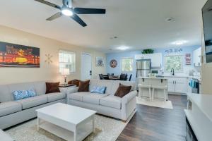 a living room with a couch and a table at FSU Seminole SpearIt House in Tallahassee