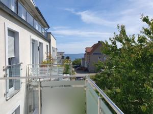 an apartment balcony with a view of a street at Holiday apartment with 2 bedrooms in Sassnitz