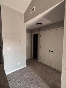 an empty garage with white walls and a ceiling at Modern & Cozy Apartment Stay in Olathe