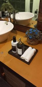 a bathroom counter with a sink and two towels at LUMBINI home stay in Colombo +11 photos