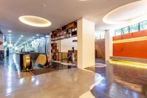 a lobby of a building with a large room with a counter at Studio Aconchego - 2 Bedrooms with Wi-Fi Subway in Sao Paulo