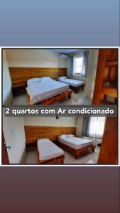een kamer met twee bedden in een kamer bij Seven76Residence in Barra Velha