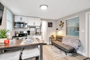 a living room with a couch and a table at Newly Updated Modern 1-Bedroom Private Guesthouse in Clearwater