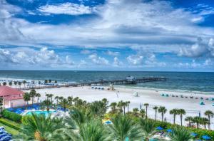 an aerial view of a beach with palm trees and a pier at Newly Updated Modern 1-Bedroom Private Guesthouse in Clearwater