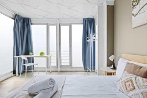 a bedroom with a bed with blue curtains and a desk at Private Double Room - Centrally Located At Ryde - Shared Bathroom in Sydney +21 photos