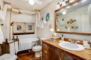 a bathroom with a sink and a tub and a toilet at Sues Mountain Charm Fire Pit Mountain Views in Hendersonville +45 photos