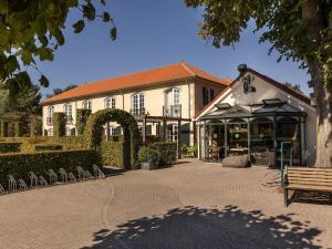 a building with a bench in front of it at Holiday Home in Diessen near Tilburg 