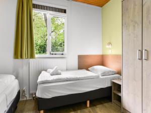 Ένα ή περισσότερα κρεβάτια σε δωμάτιο στο Pet-Friendly Forest Escape +18 φωτογραφίες